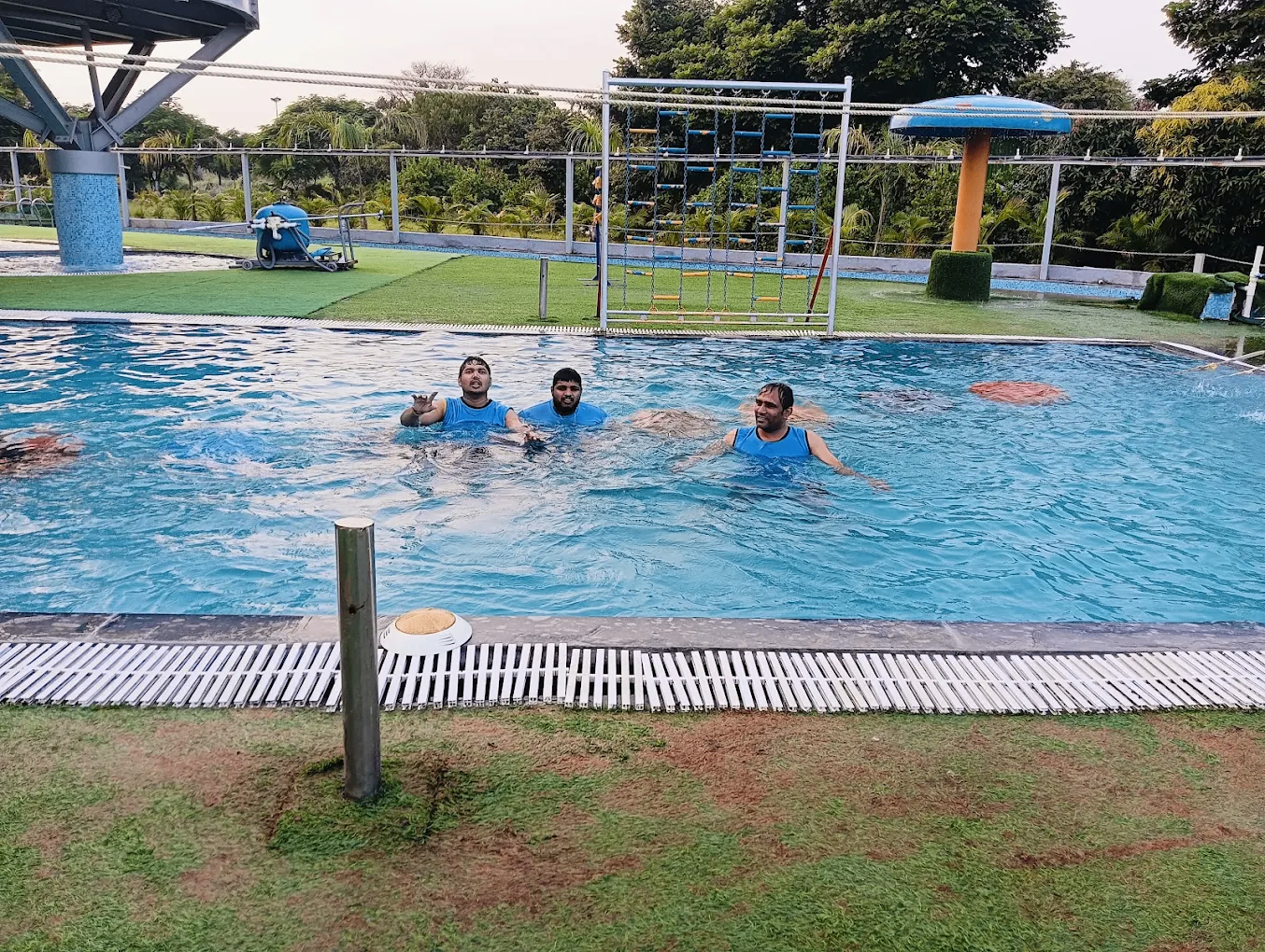 Friends cooling off in the outdoor pool