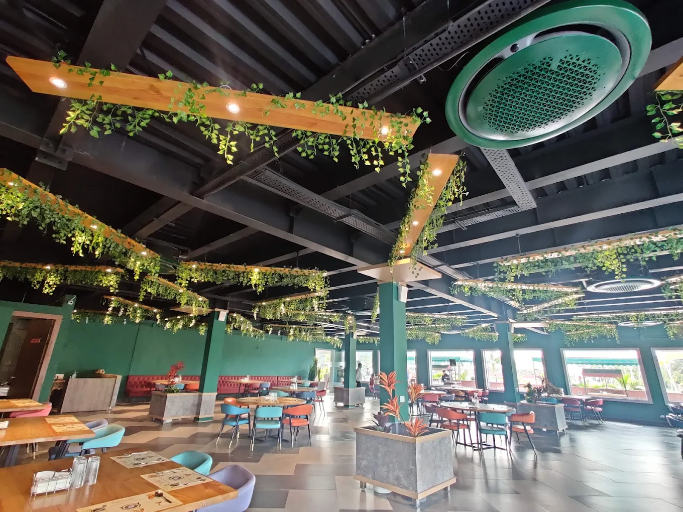 Forest-green restaurant with hanging vines