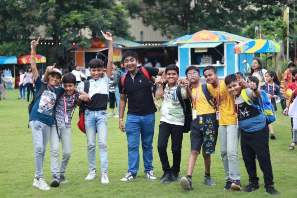 Group of friends laughing on the lawn