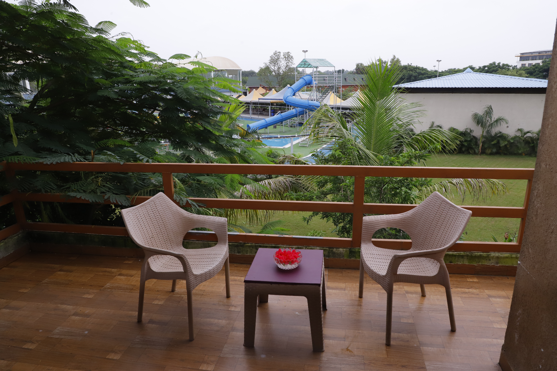 Private balcony overlooking the pool and water slides